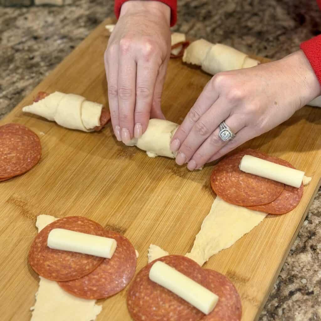 Rollin up pizza crescent rolls.