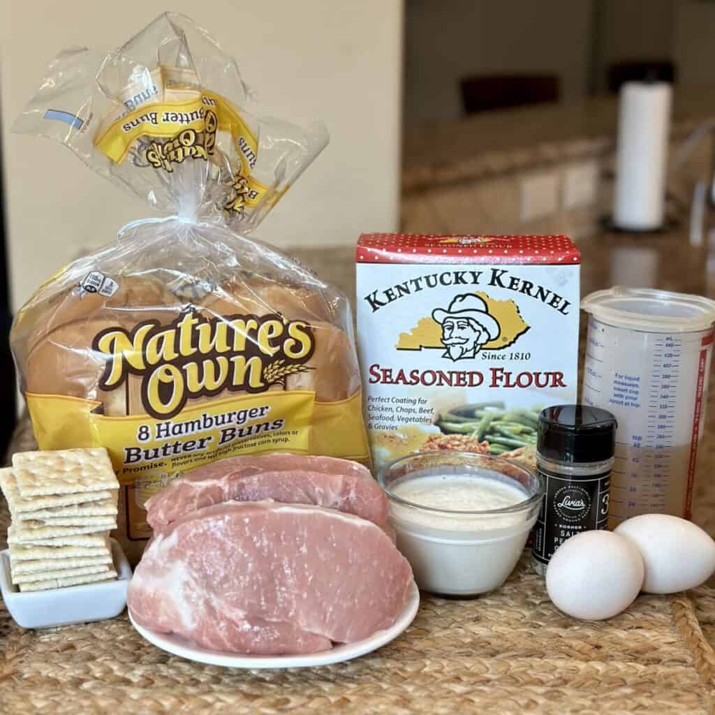 The ingredients to make a pork tenderloin sandwich.