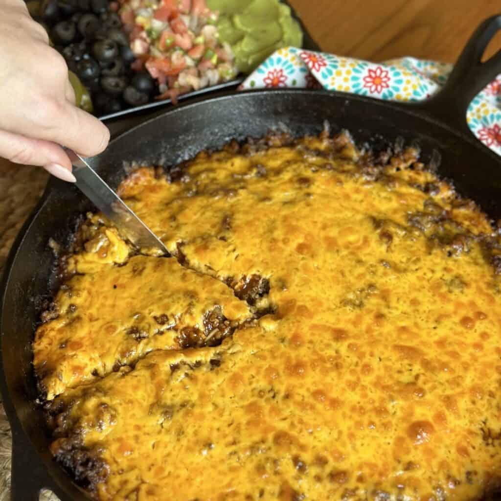 Slicing a beef tamale pie.