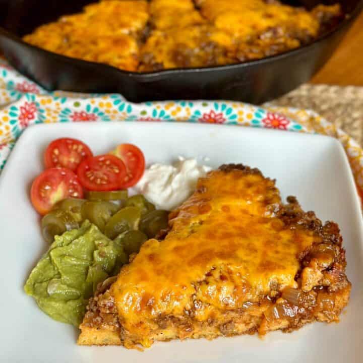 A slice of jiffy tamale pie on a plate.