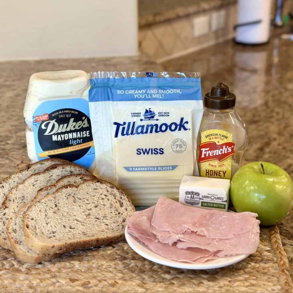 The ingredients to make a ham and cheese panini.