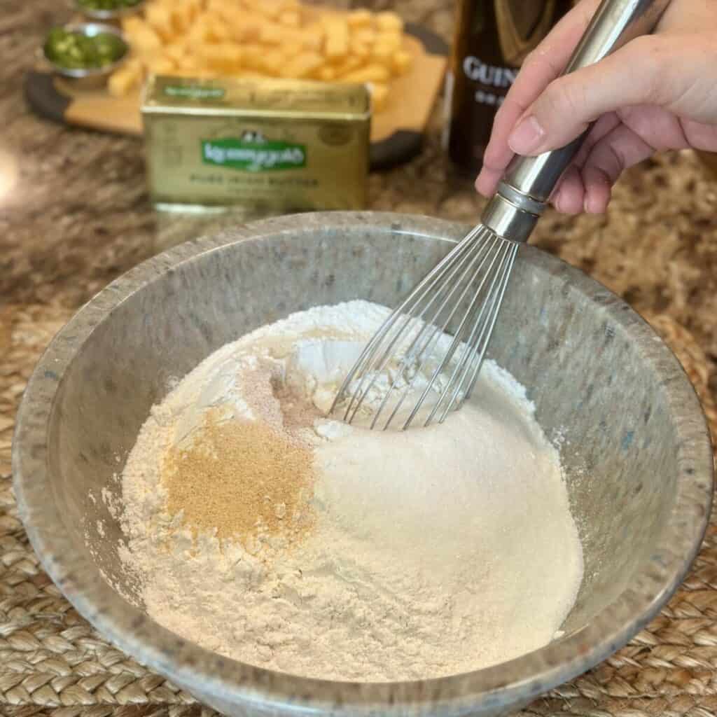 Whisking together dry ingredients for bread.