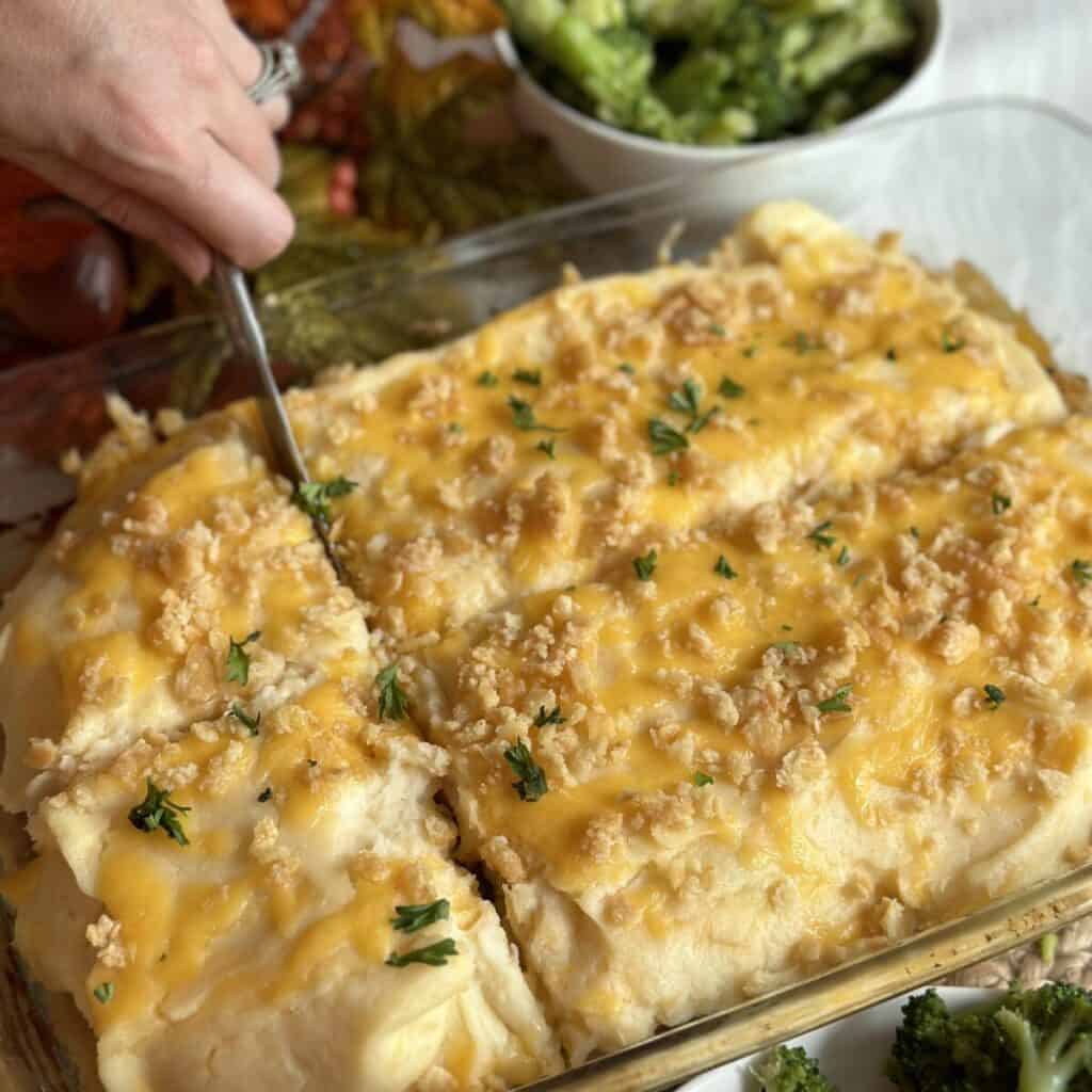 Cutting a meatloaf casserole.