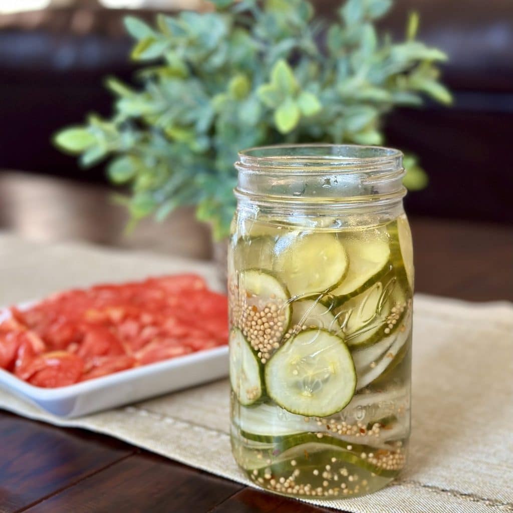 Homemade overnight pickles in a jar.