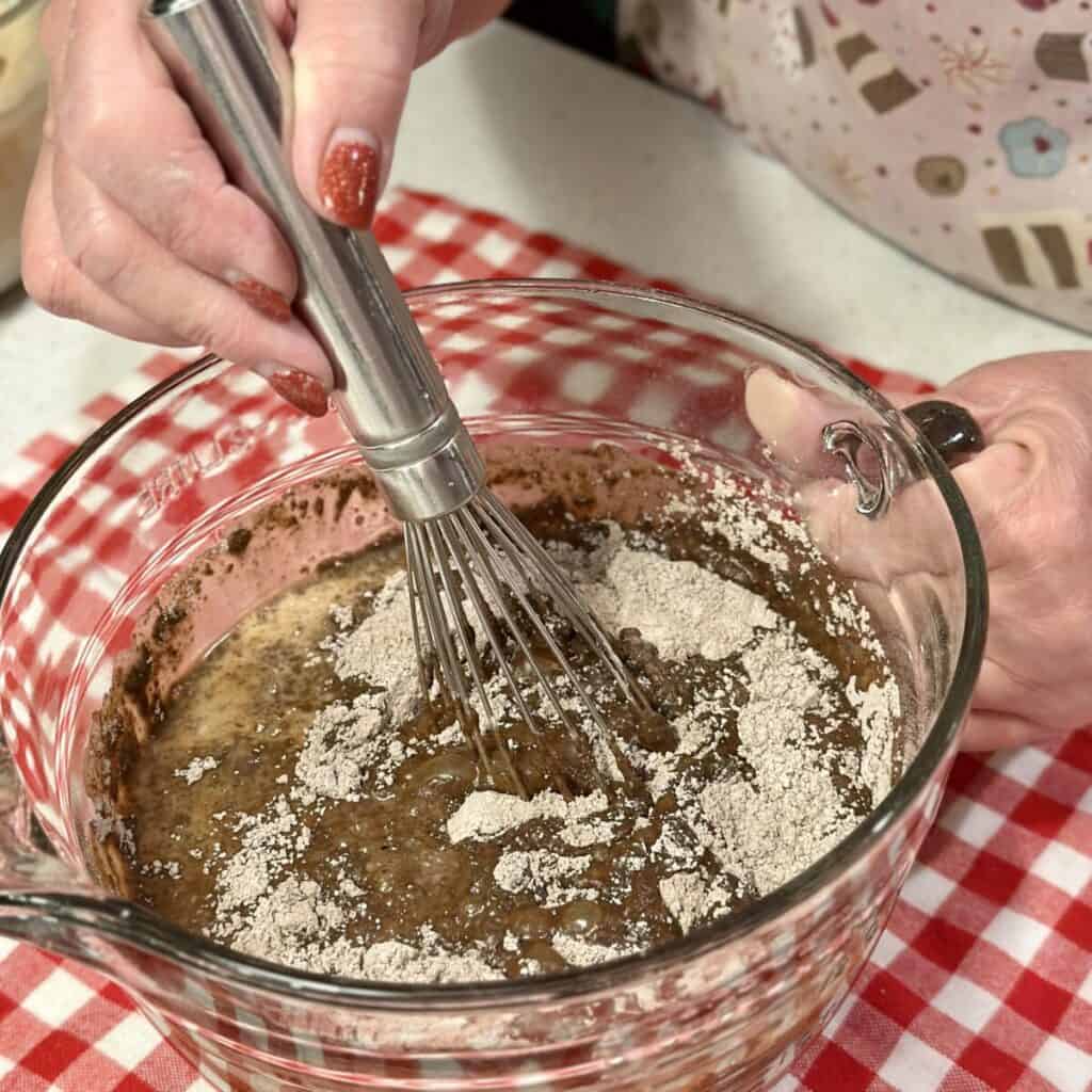 Mixing together pudding in a bowl.