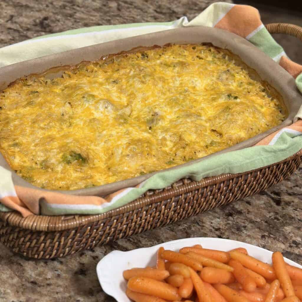 A pan of cheesy broccoli chicken and rice casserole.