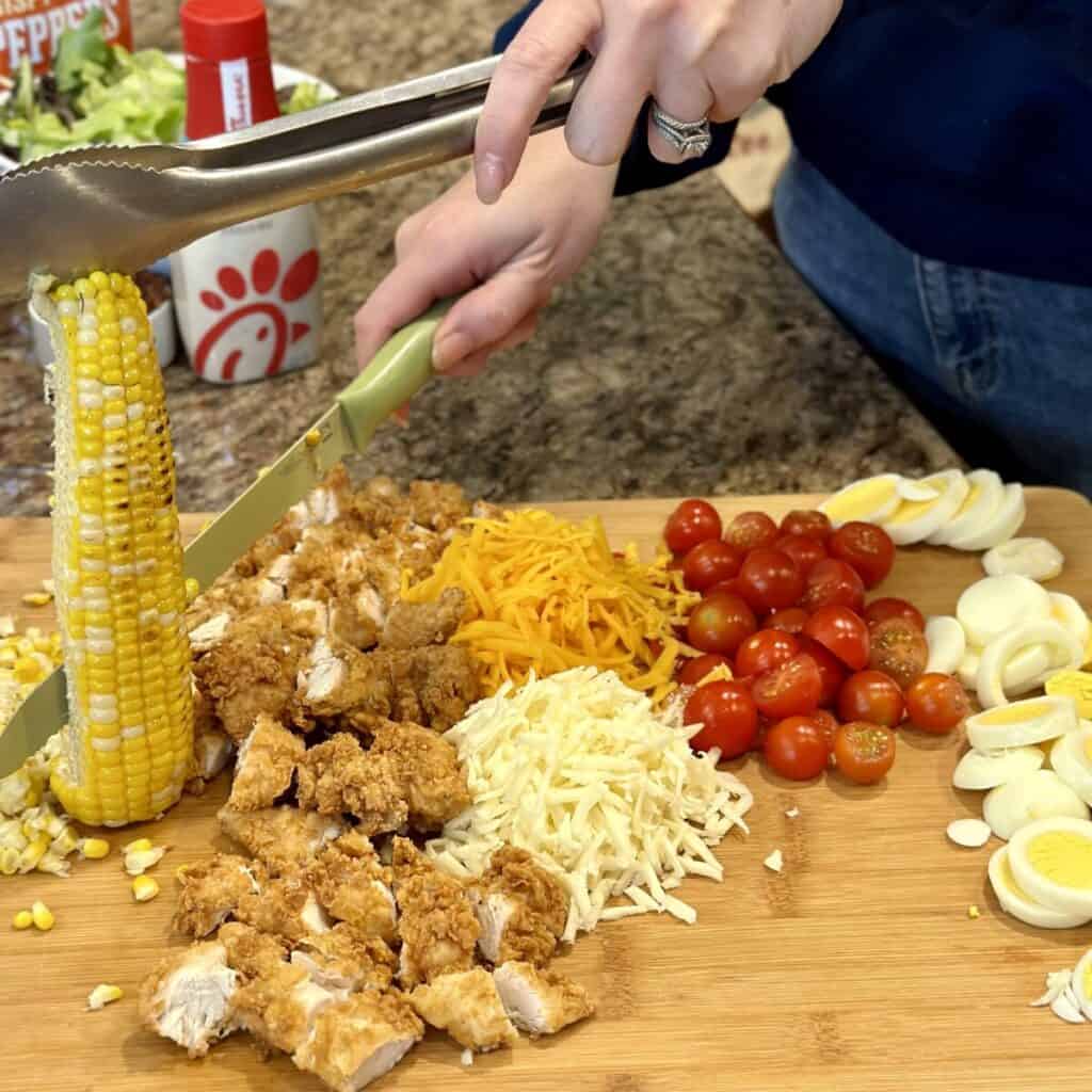 Cutting corn off a cob.