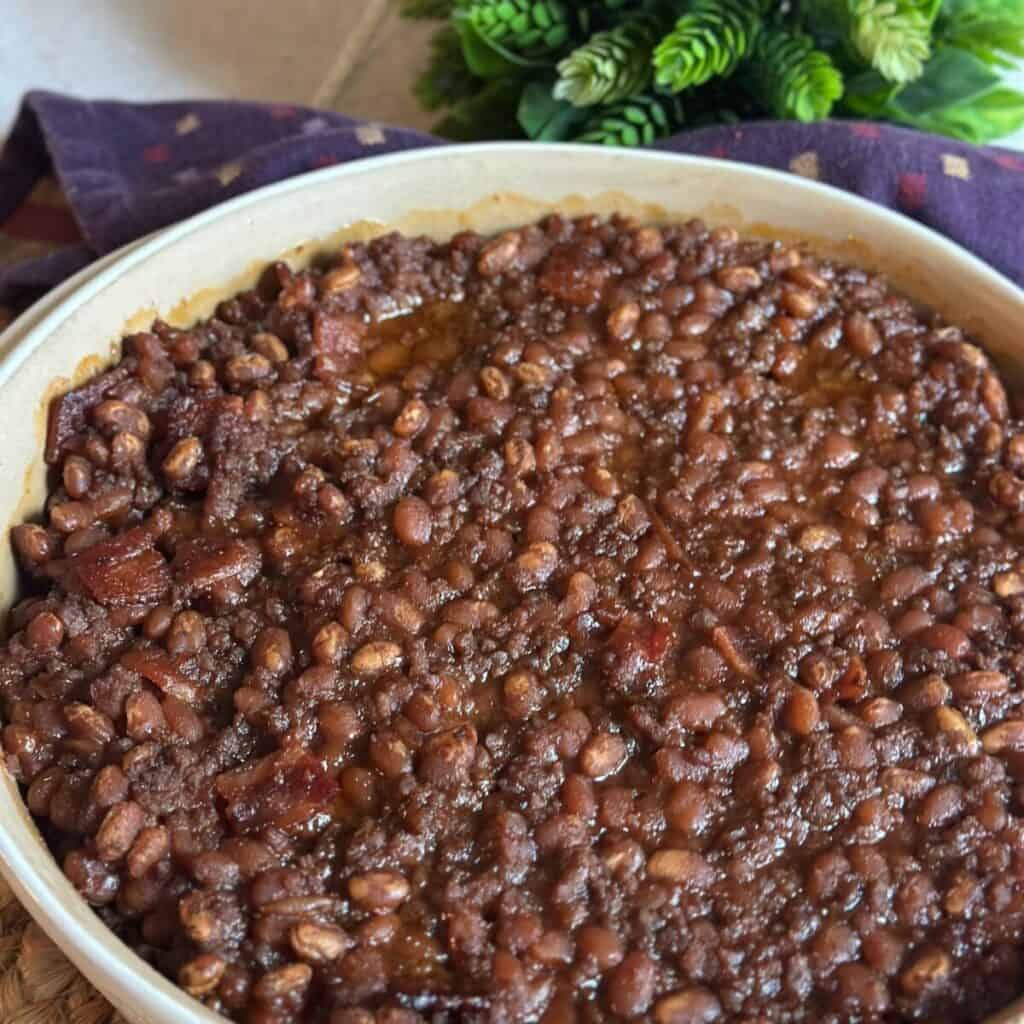 A pan of baked beans with ground beef.