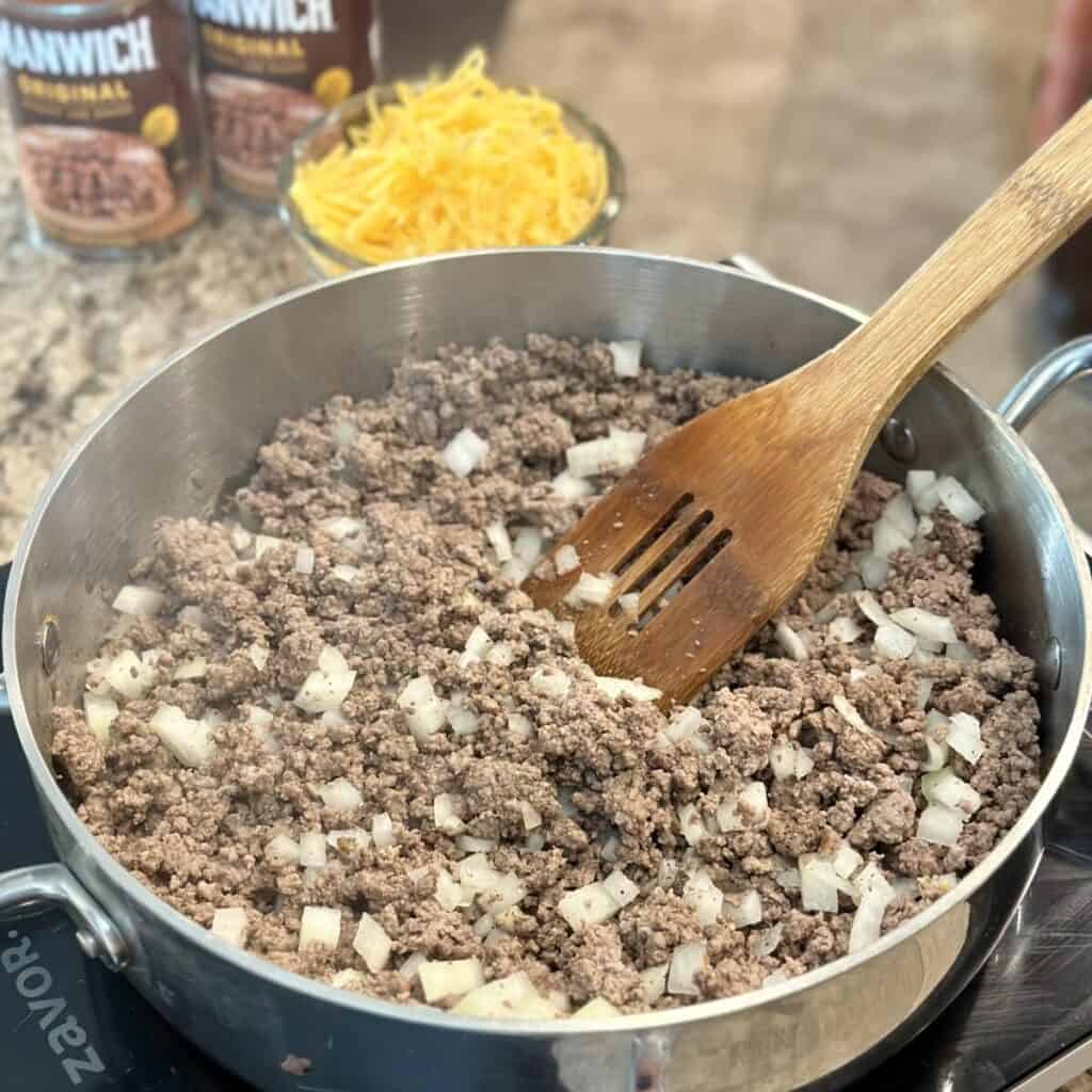 Browning beef in a skillet.