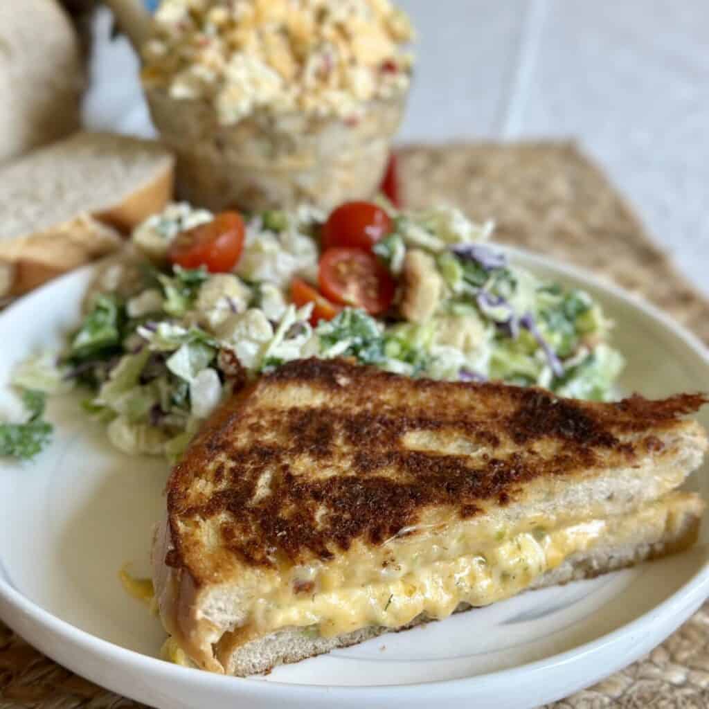 A close up shot of a grilled cheese sandwich made with pimento cheese.