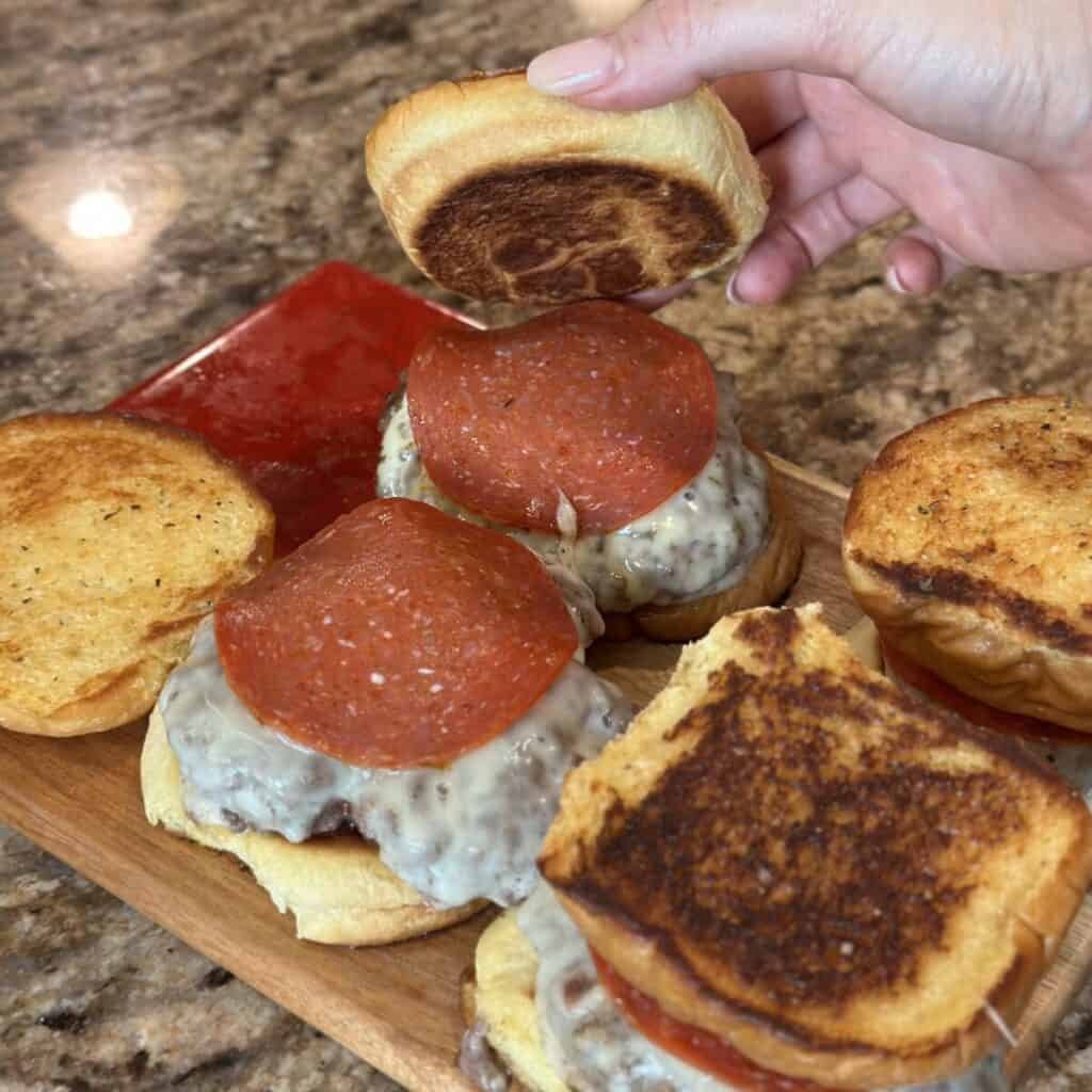 Building a pizza burger.