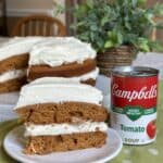 A slice of tomato soup cake on a plate.