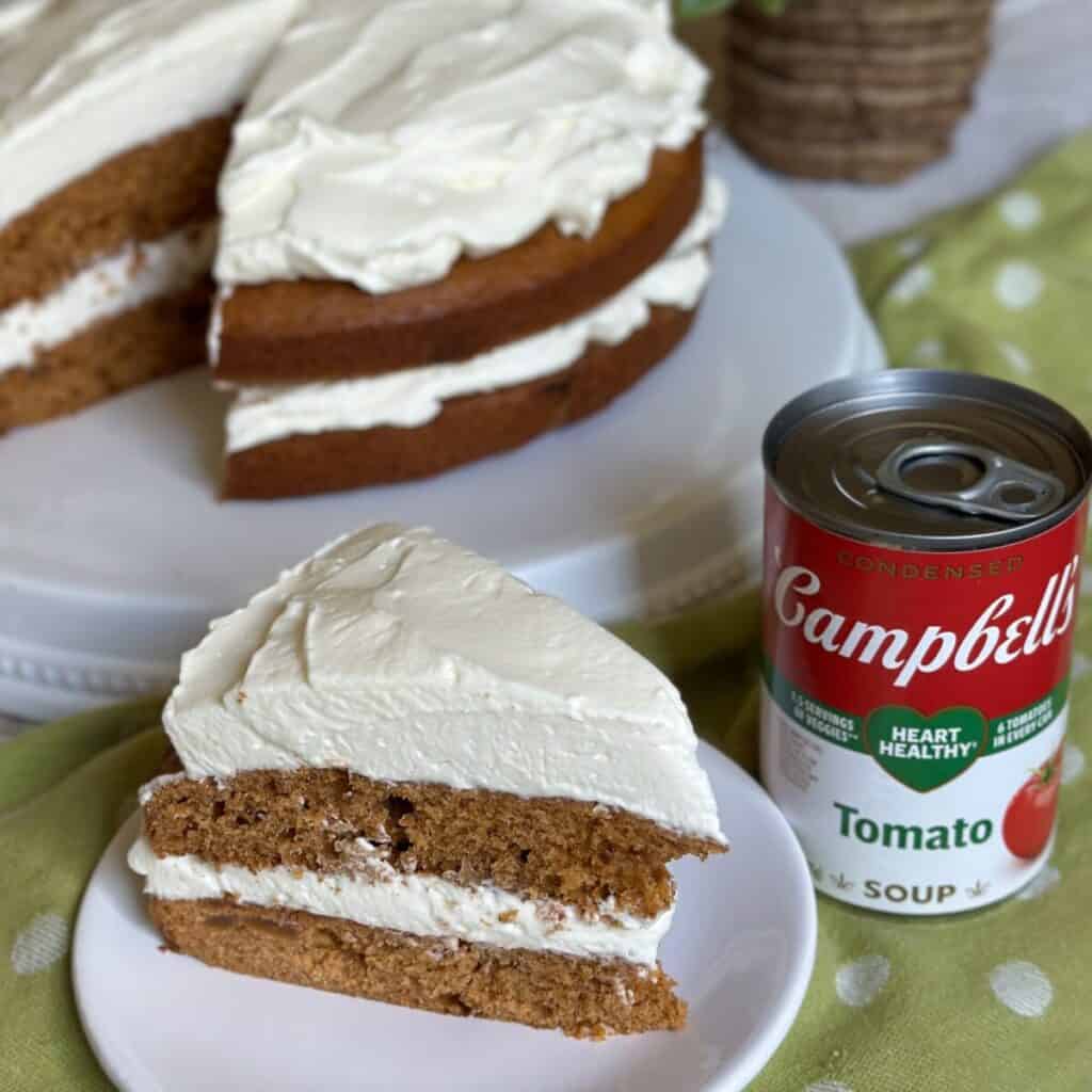 A slice of tomato soup cake on a plate.