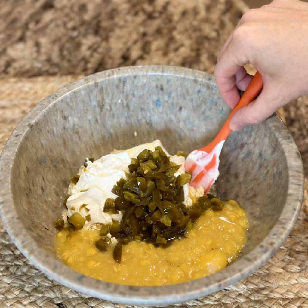 The ingredients in a bowl to make cornbread for the bottom of cornbread chili pie.