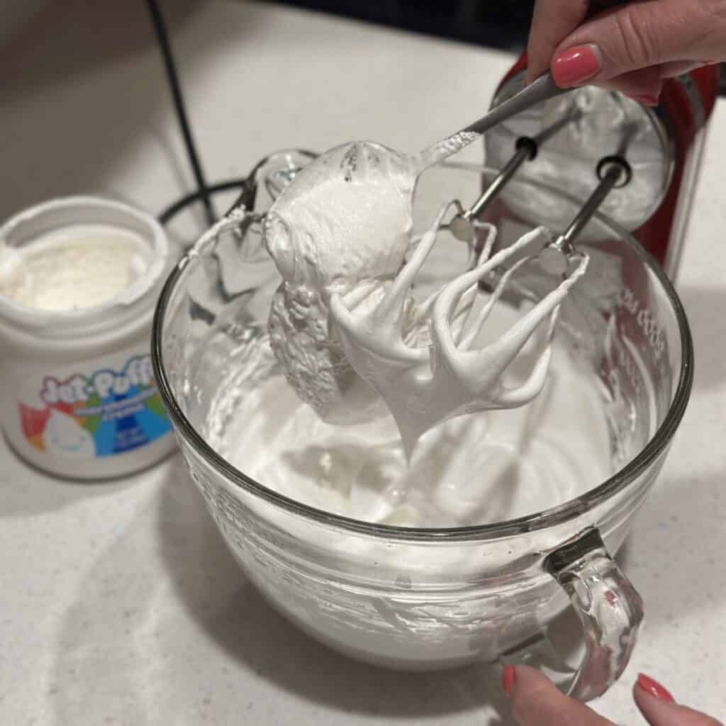 Making meringue for a pie.