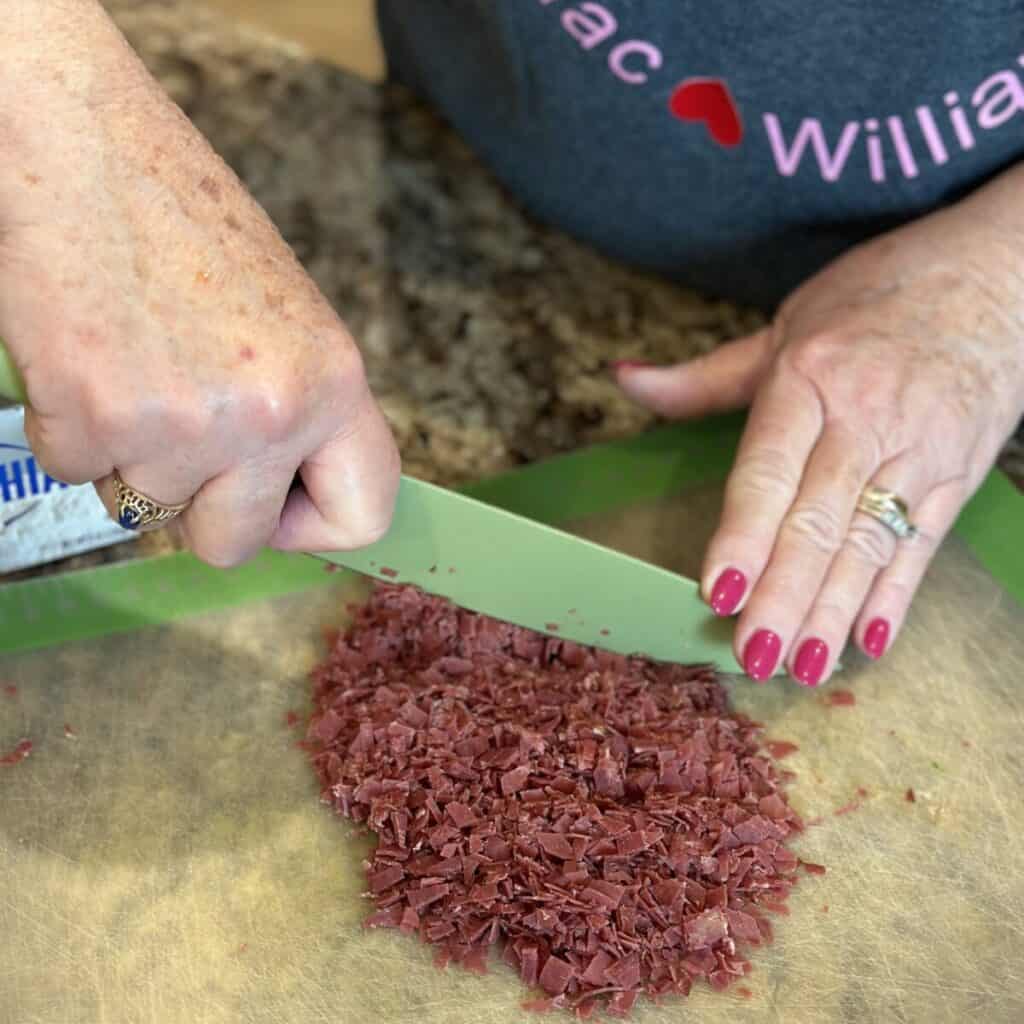 Dicing dried beef.