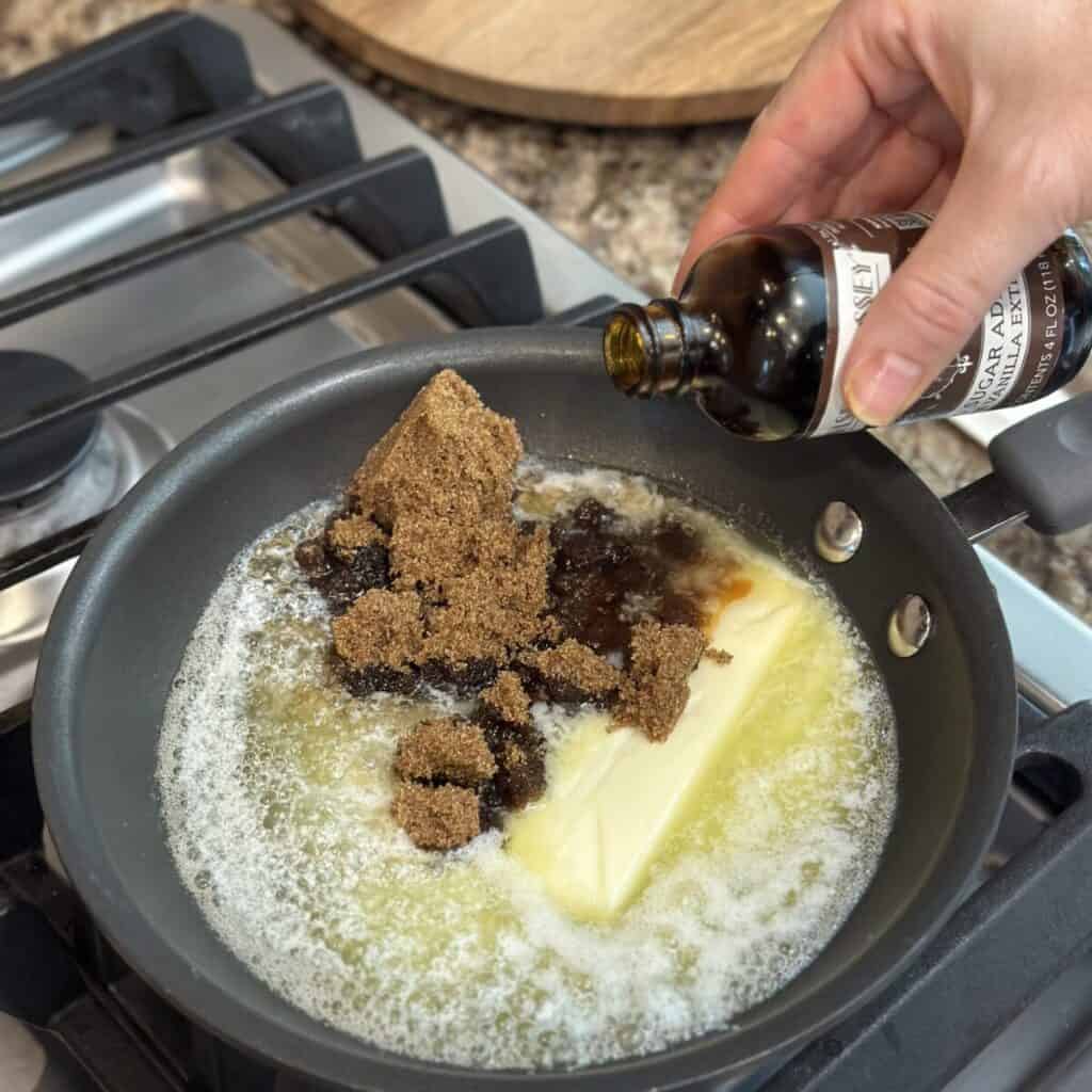 Melting brown sugar and butter in a skillet.