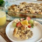 A serving of biscuits and gravy casserole on a plate.