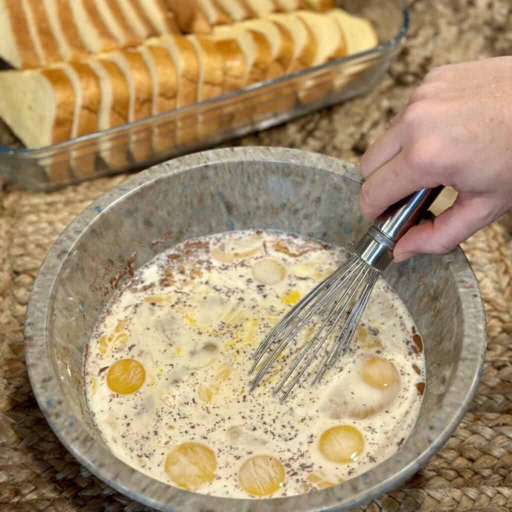 Whisking the custard for a baked french toast.