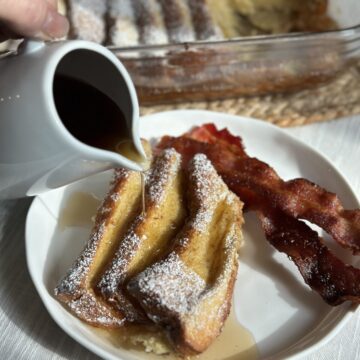 Pouring syrup on french toast.