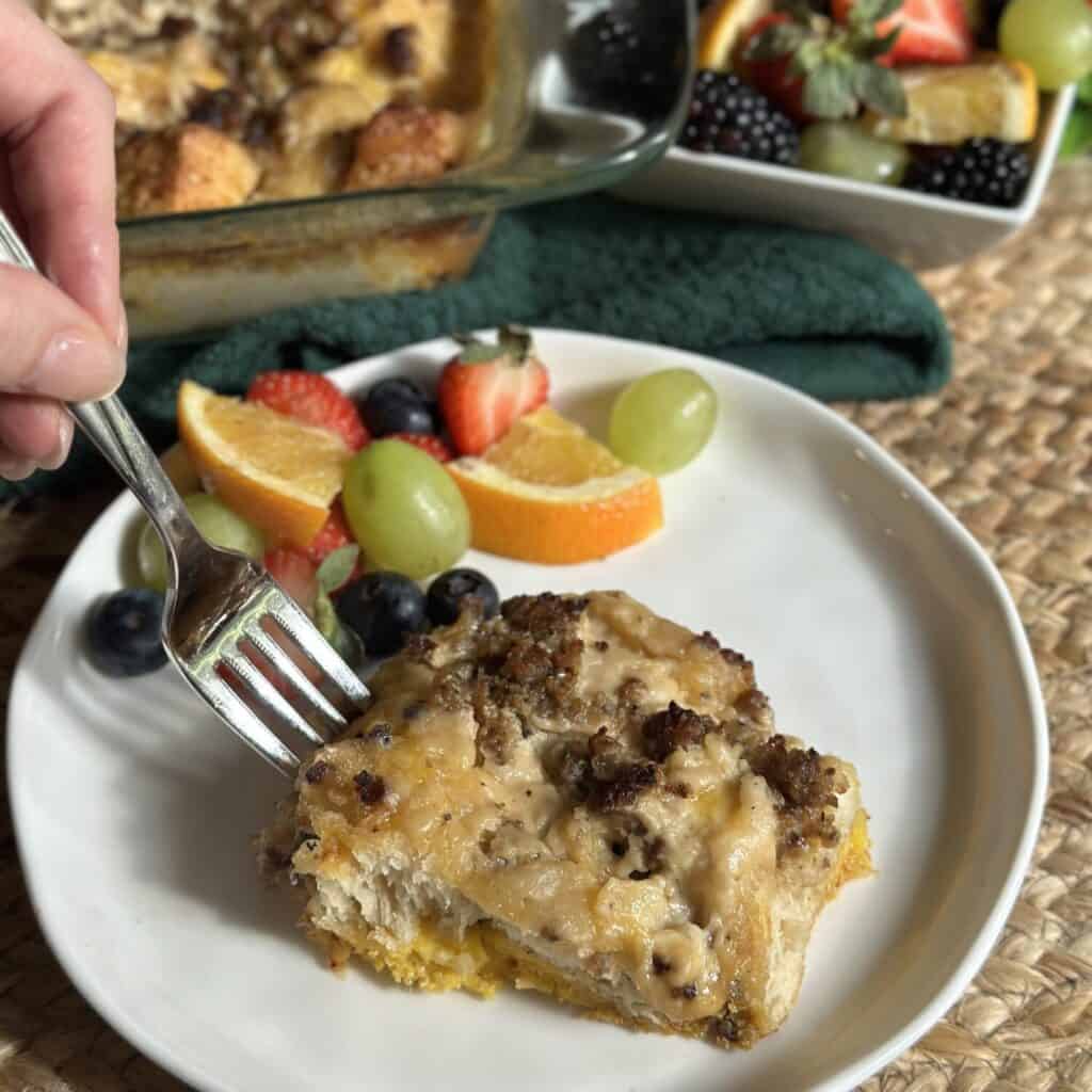 A serving of biscuits and gravy casserole on a plate.