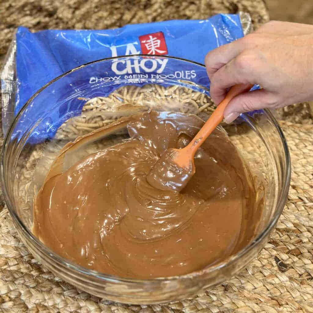 Ingredients in a bowl for haystack cookies.