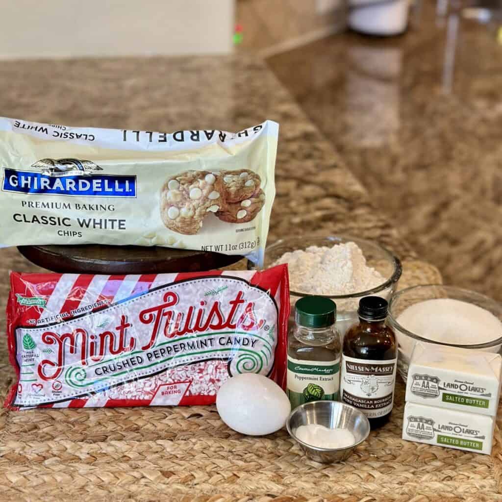 The ingredients to make white chocolate peppermint cookies.