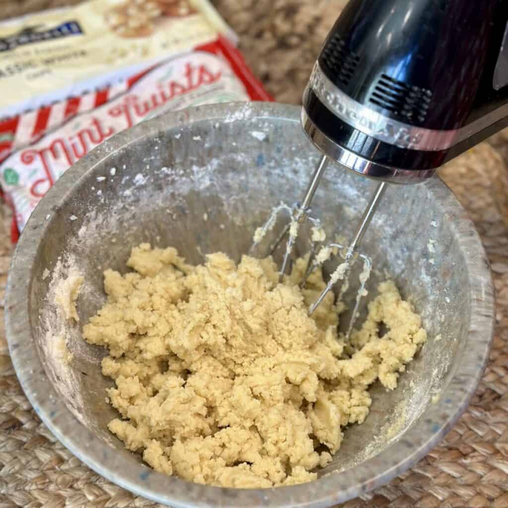 Mixing cookie dough in a pan.