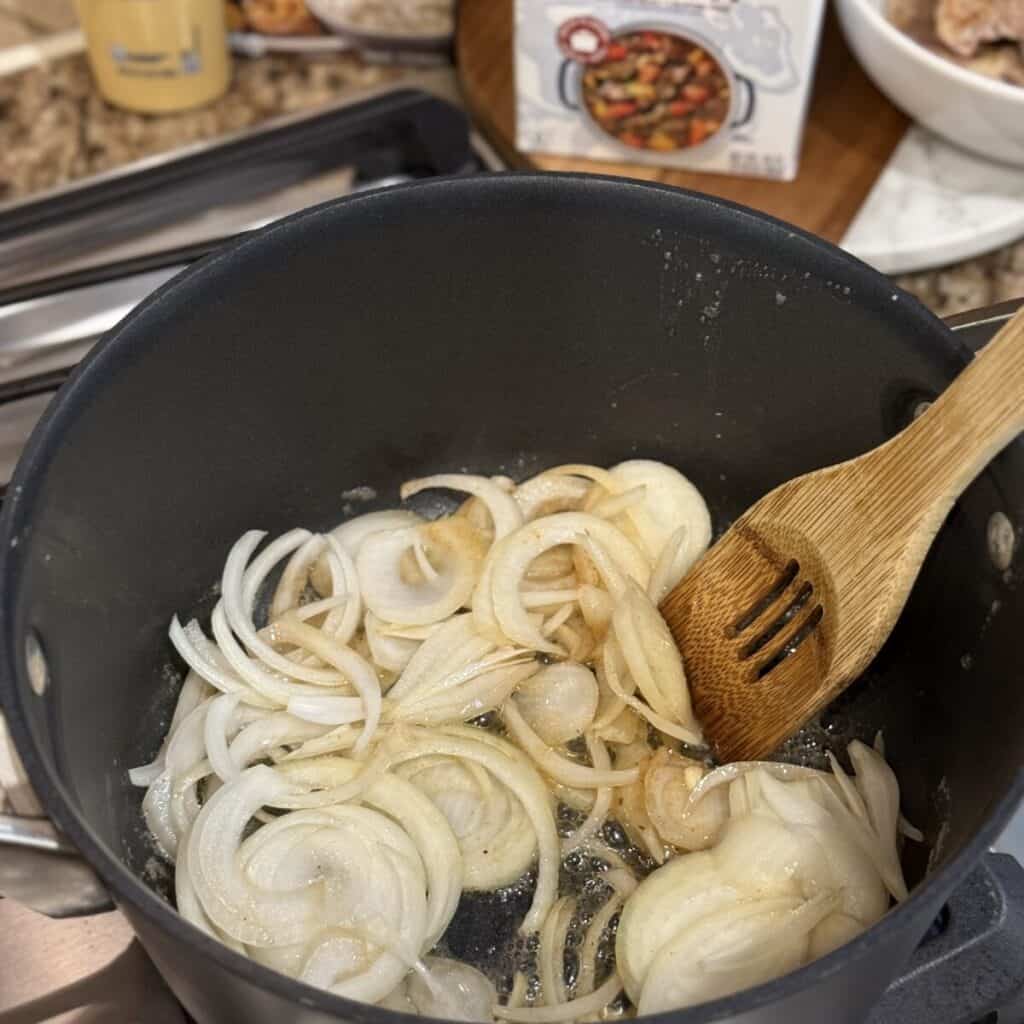 Sautéing onions in a pan.