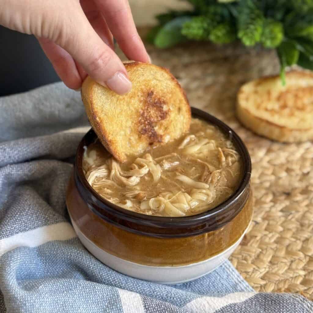 A bowl of French onion chicken soup.