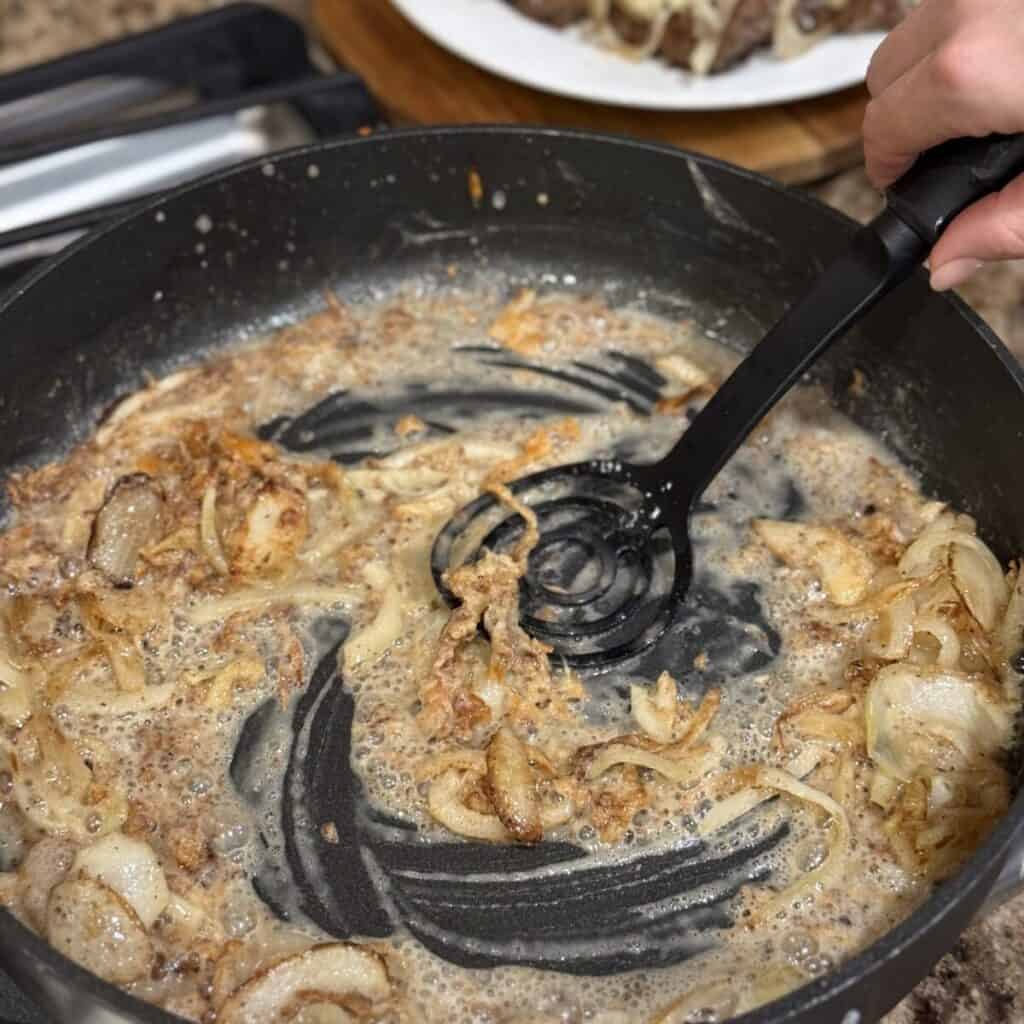 Mixing grease and flour in a skillet.