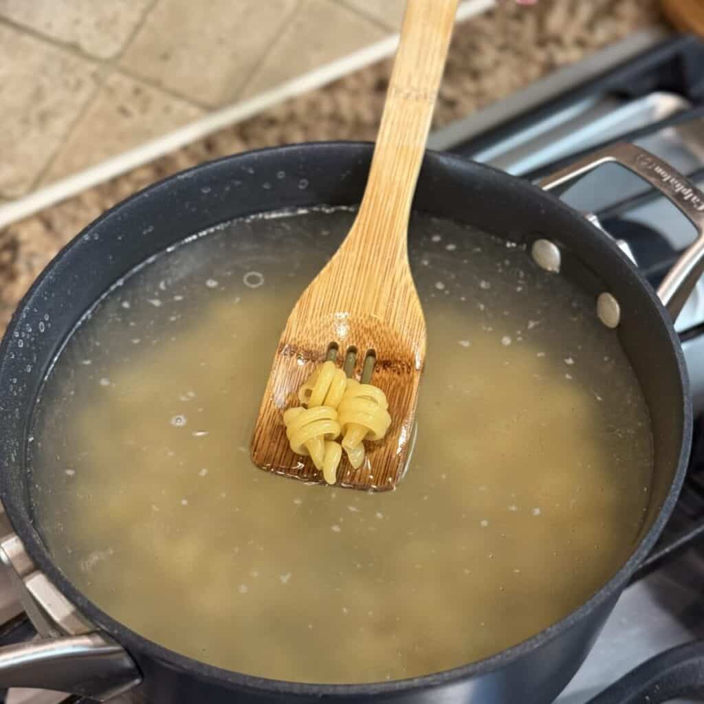 Cooking pasta in water.