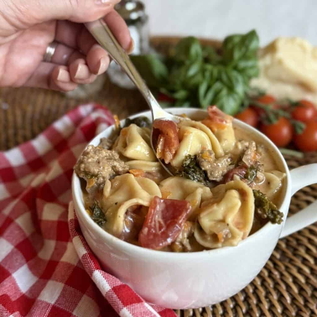 A bowl of crockpot sausage tortellini soup.