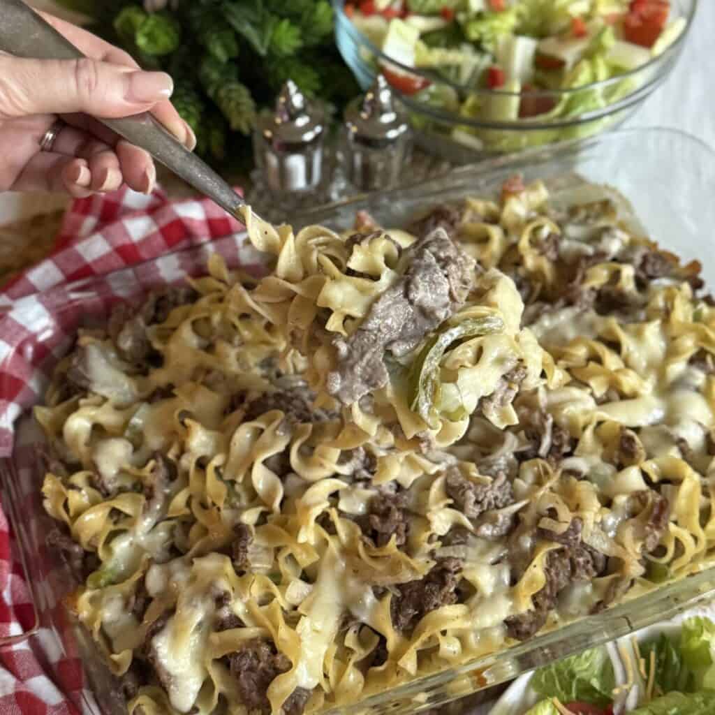 A casserole dish of philly cheesesteak casserole.