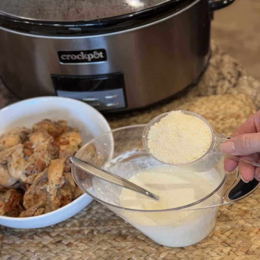 whisking together cornstarch, milk and parmesan cheese.