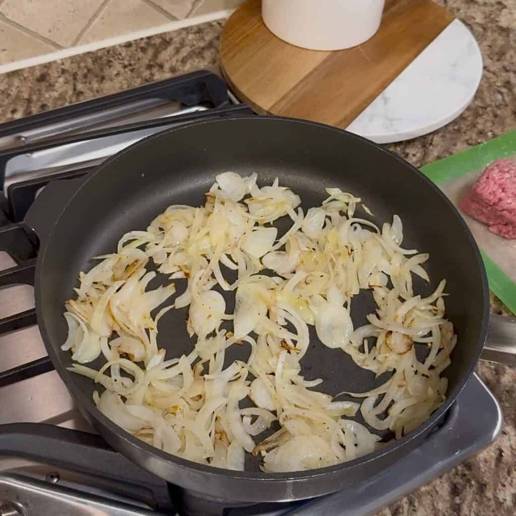 A skillet of sautéed onions.