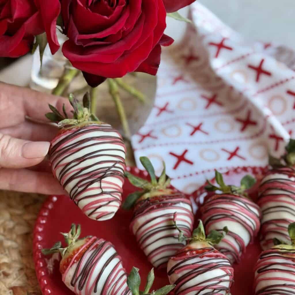 A plate of white chocolate covered strawberries.