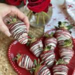 A plate of white chocolate covered strawberries.