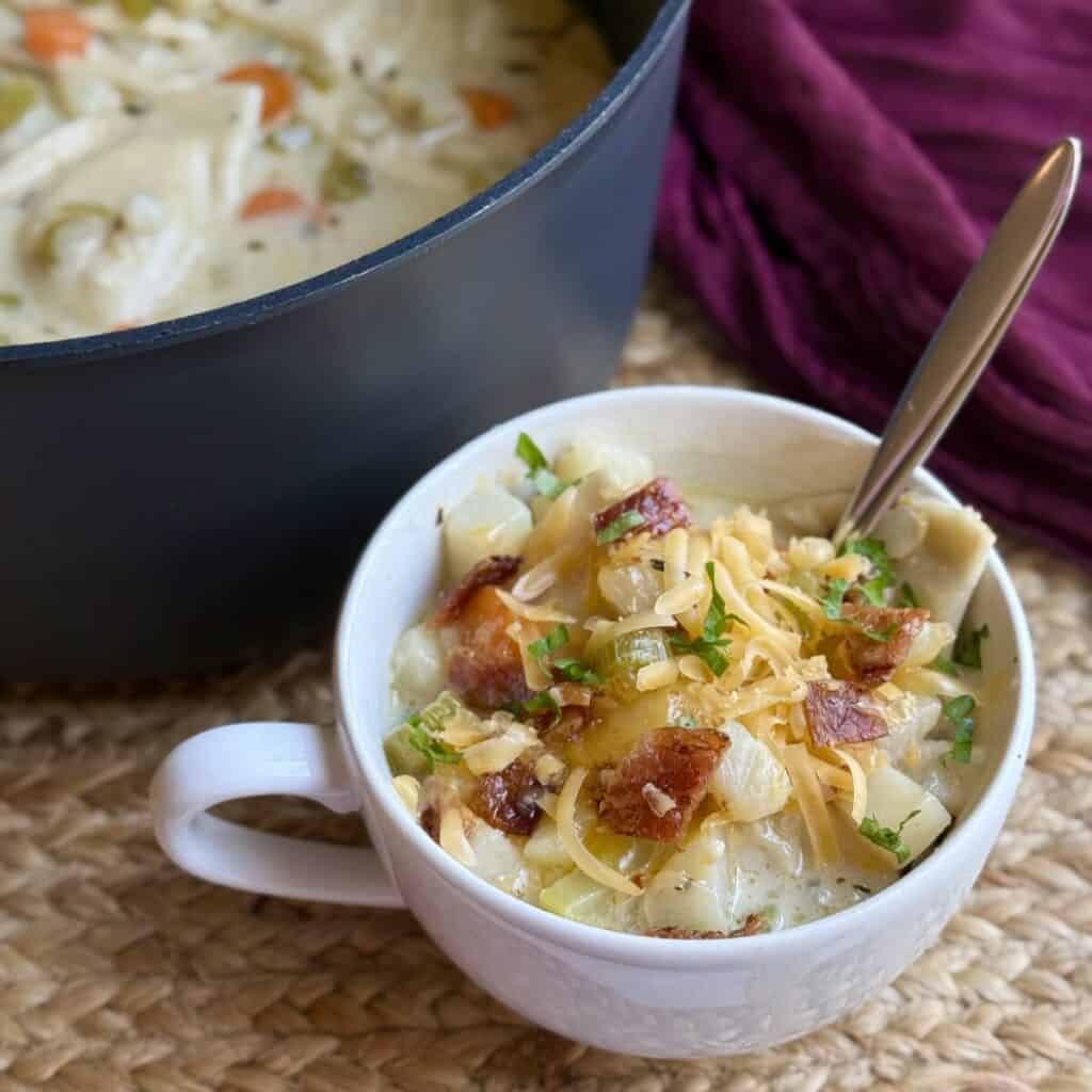 A pan and bowl of pierogi soup.