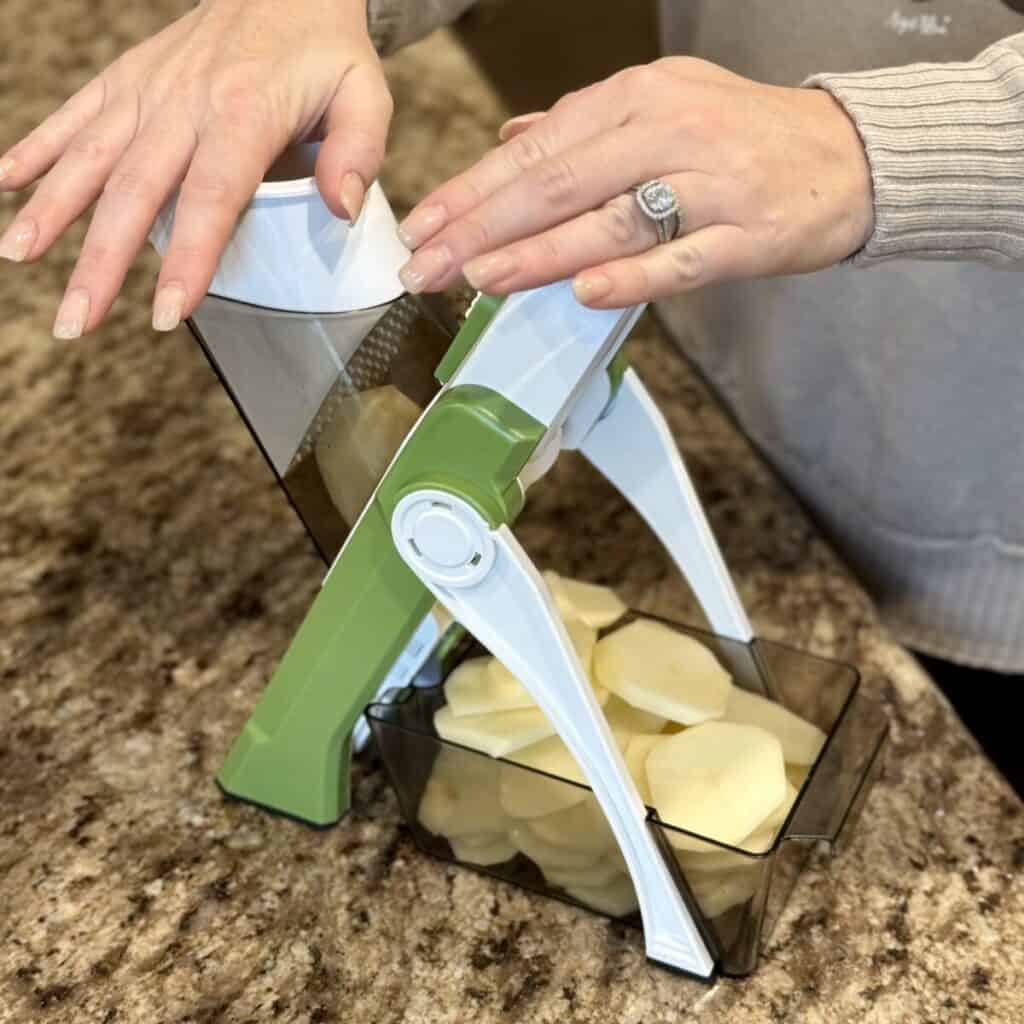 Slicing potatoes.