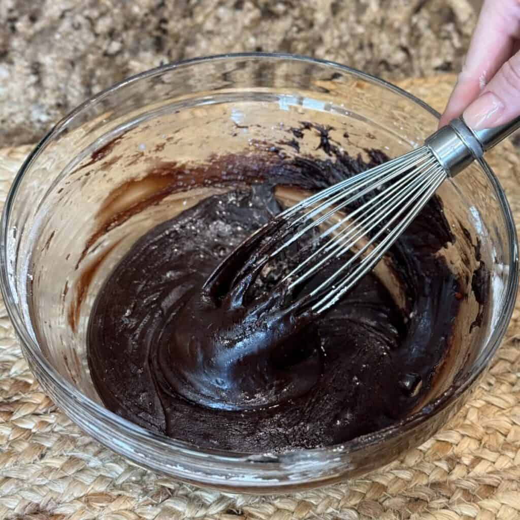 Mixing icing in a bowl.