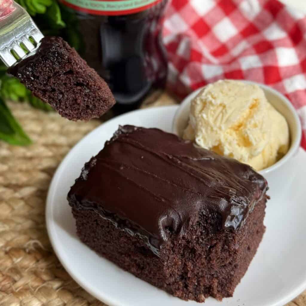 A slice of copycat Cracker Barrel coca-cola cake on a plate.