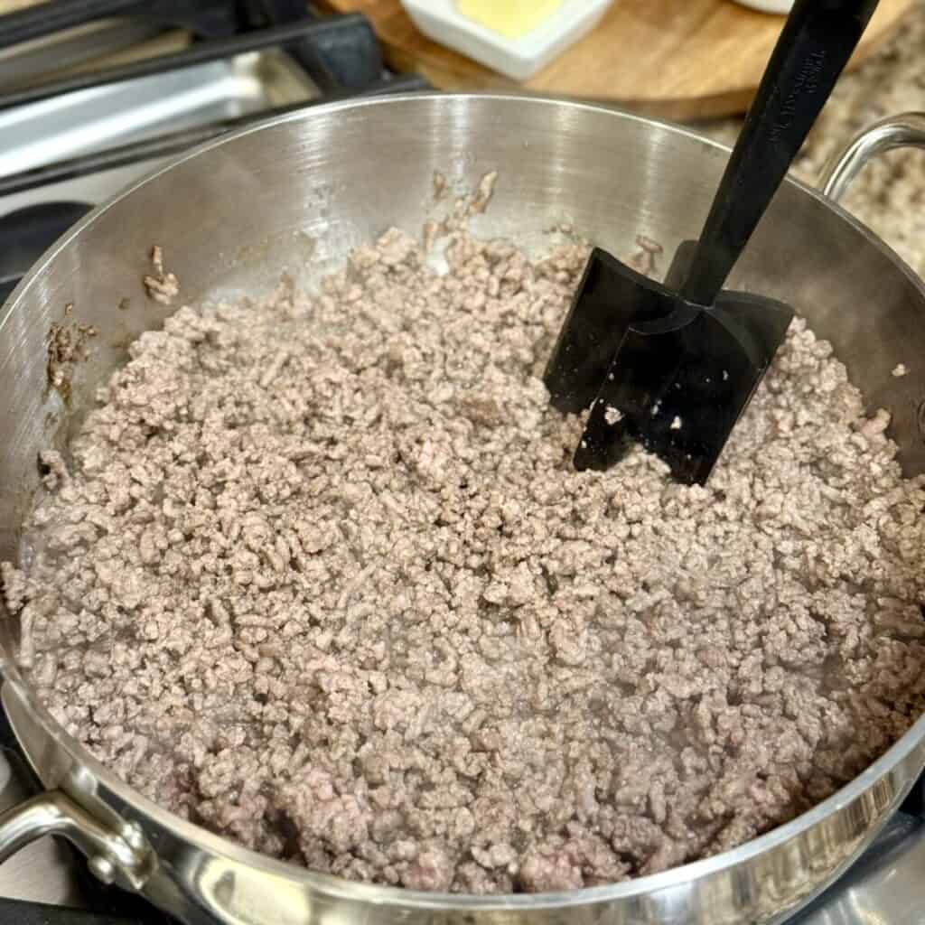 Browning gravy in a pan.