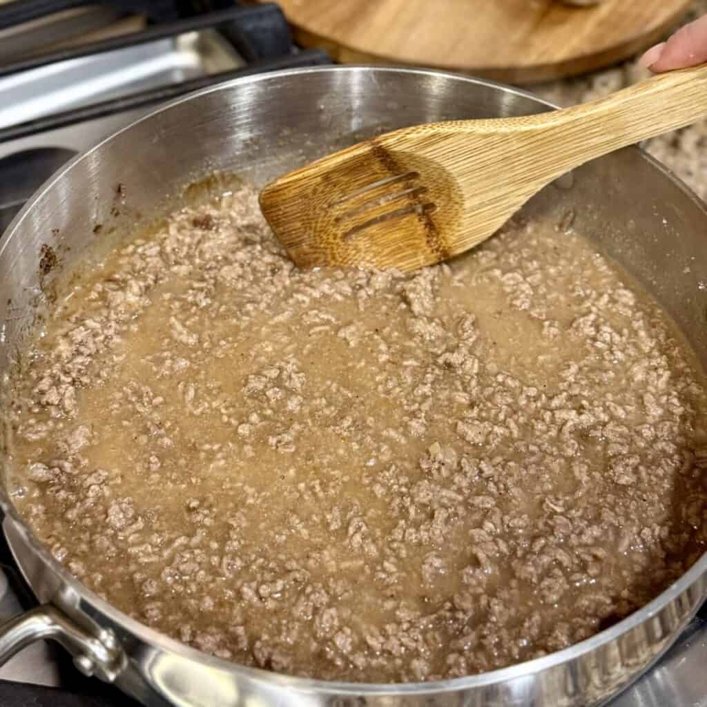 A pan of ground beef and gravy.