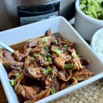 A serving of slow cooker apricot chicken, rice, and broccoli.