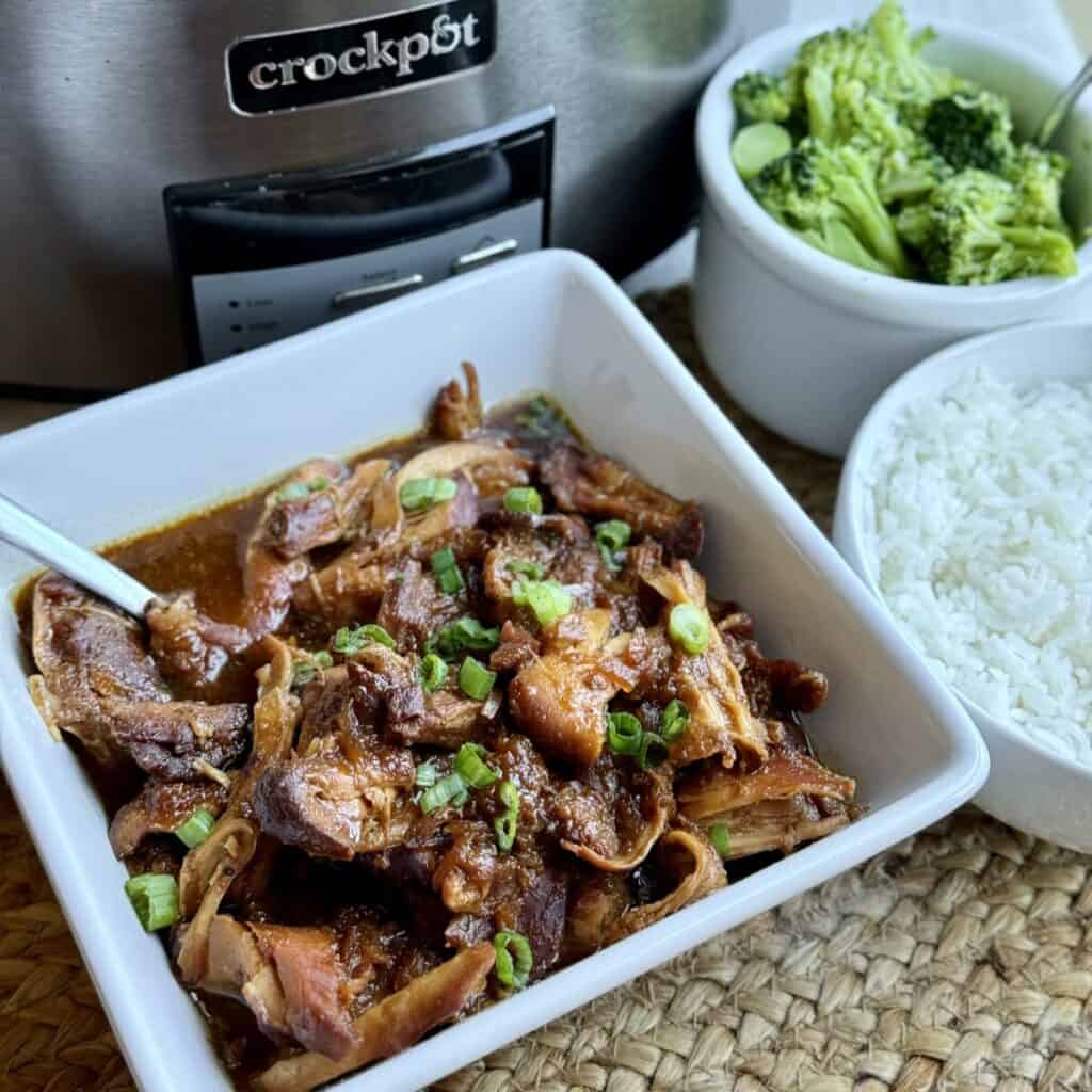 A serving of slow cooker apricot chicken, rice, and broccoli.