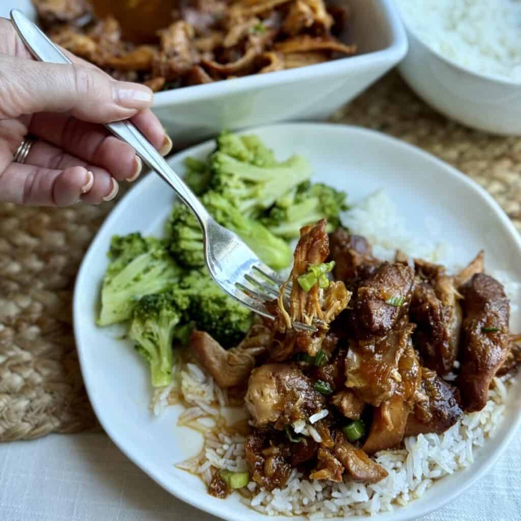 A serving of slow cooker apricot chicken, rice, and broccoli.